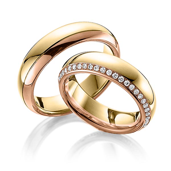 Set Bicolor Memoire-trouwringen in geelgoud 14 kt. roodgoud 14 kt. volledig gezet met in totaal 0,47 ct. Briljant tw/si van Eternal Touch