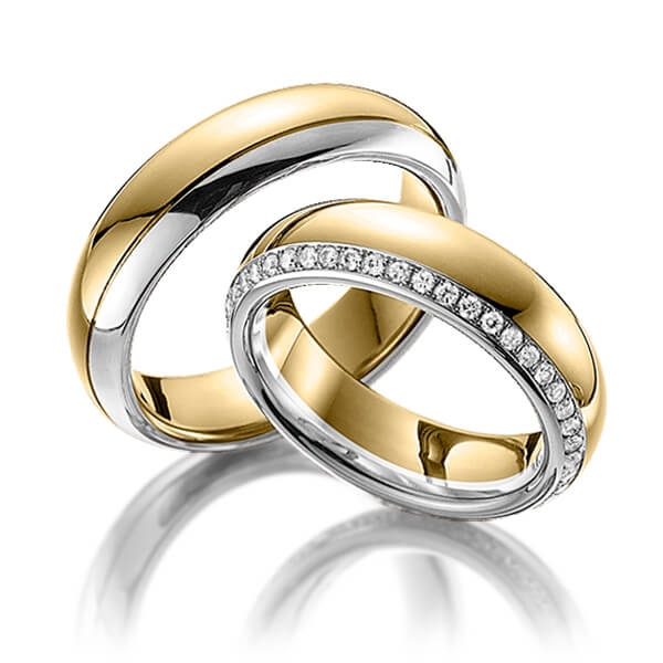 Set Bicolor Memoire-trouwringen in geelgoud 14 kt. witgoud 14 kt. volledig gezet met in totaal 0,47 ct. Briljant tw/si van Steinberg