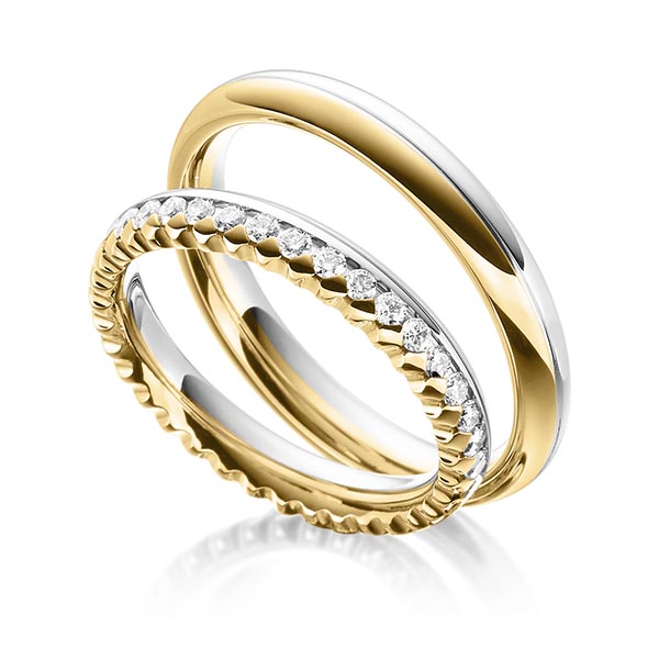 Set Bicolor Memoire-trouwringen in geelgoud 14 kt. witgoud 14 kt. volledig gezet met in totaal 0,72 ct. Briljant tw/si van Steinberg