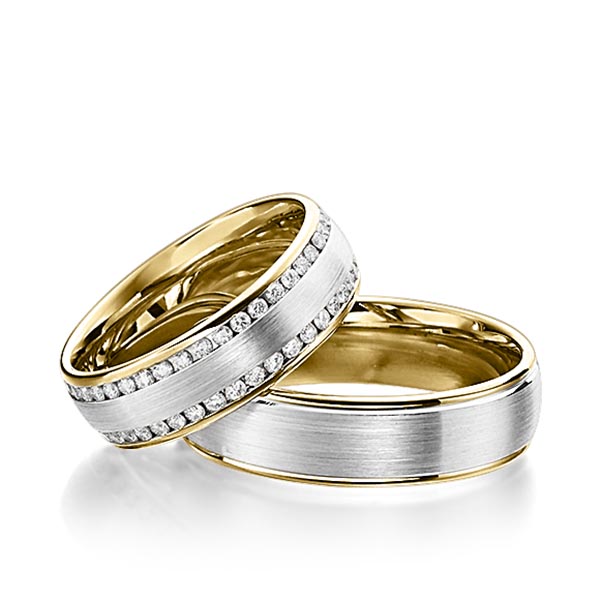 Set Bicolor Memoire-trouwringen in geelgoud 14 kt. witgoud 14 kt. volledig gezet met in totaal 0,92 ct. Briljant tw/si van Steinberg