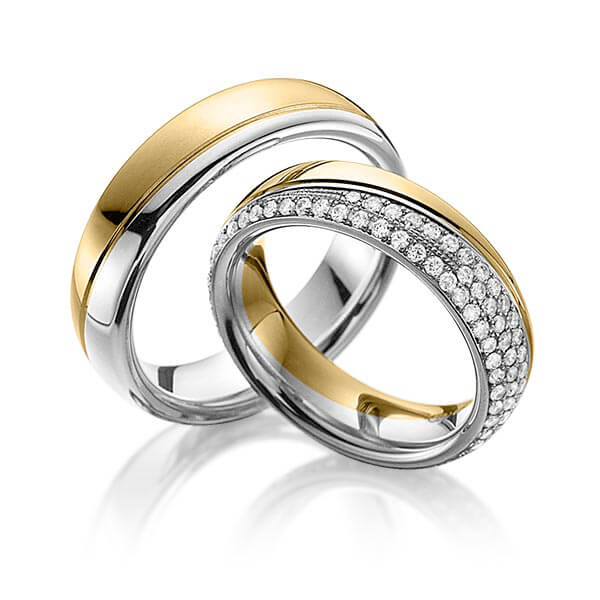 Set Bicolor Memoire-trouwringen in geelgoud 18 kt. platina 950 volledig gezet met in totaal 0,85 ct. Briljant tw,vs van Eternal Touch