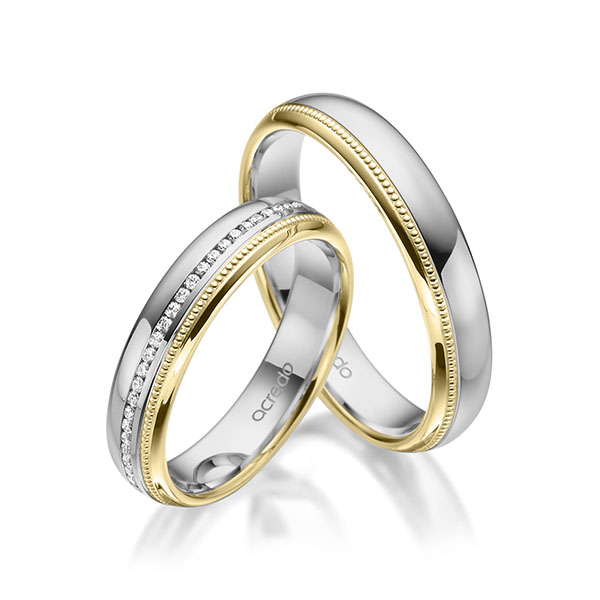 Set Bicolor Memoire-trouwringen in grijsgoud 14 kt. geelgoud 14 kt. volledig gezet met in totaal 0,295 ct. Briljant tw/si van acredo