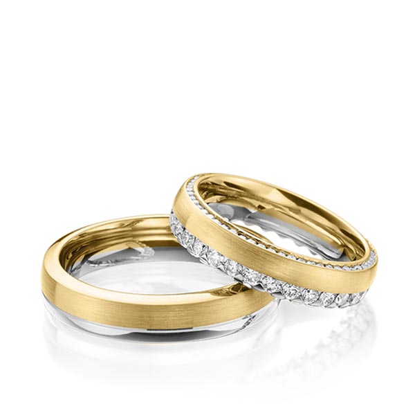 Set Bicolor Memoire-trouwringen in grijsgoud 14 kt. geelgoud 14 kt. volledig gezet met in totaal 1,265 ct. Briljant tw/si van Steinberg