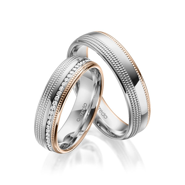Set Bicolor Memoire-trouwringen in grijsgoud 14 kt. roodgoud 14 kt. volledig gezet met in totaal 0,285 ct. Briljant tw/si van acredo