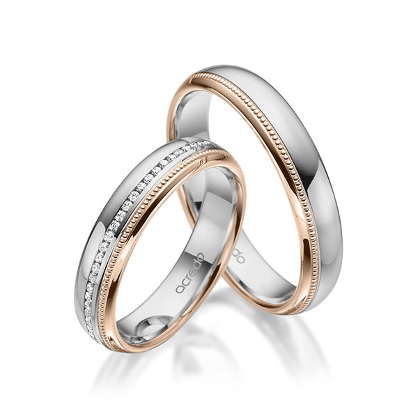 Set Bicolor Memoire-trouwringen in grijsgoud 14 kt. roodgoud 14 kt. volledig gezet met in totaal 0,295 ct. Briljant tw/si van acredo