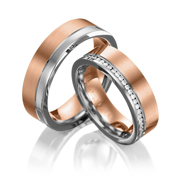Set Bicolor Memoire-trouwringen in grijsgoud 14 kt. roodgoud 14 kt. volledig gezet met in totaal 0,384 ct. Briljant tw/si van Eternal Touch