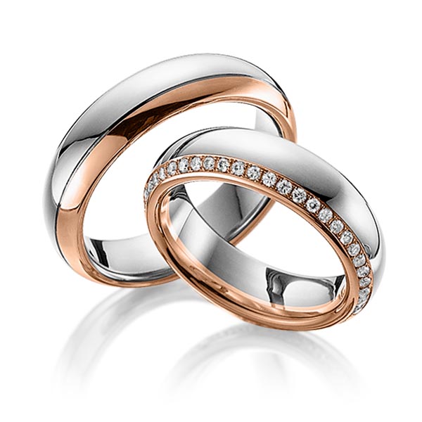 Set Bicolor Memoire-trouwringen in grijsgoud 14 kt. roodgoud 14 kt. volledig gezet met in totaal 0,47 ct. Briljant tw/si van Eternal Touch