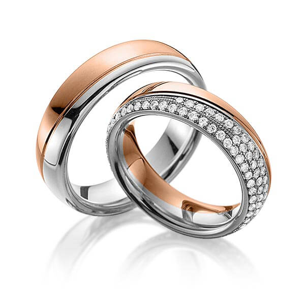 Set Bicolor Memoire-trouwringen in roodgoud 14 kt. grijsgoud 14 kt. volledig gezet met in totaal 0,85 ct. Briljant tw,vs van Eternal Touch