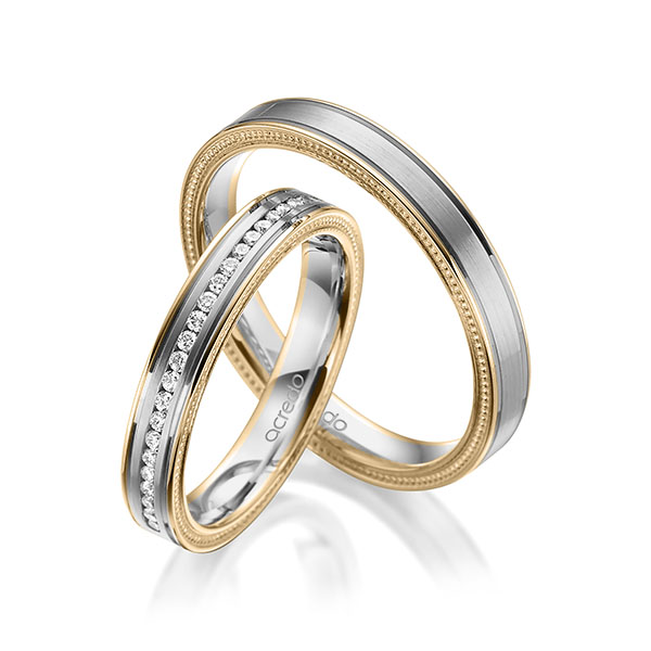 Set Bicolor Memoire-trouwringen in roségoud 14 kt. grijsgoud 14 kt. half gezet met in totaal 0,192 ct. Briljant tw/si van acredo