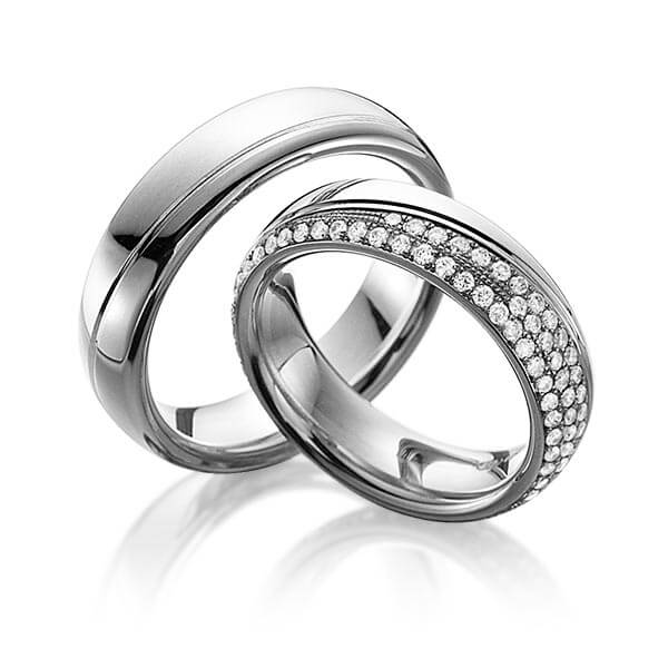 Set Bicolor Memoire-trouwringen in witgoud 14 kt. dark grey gold 14 kt. volledig gezet met in totaal 0,85 ct. Briljant tw,vs van Eternal Touch