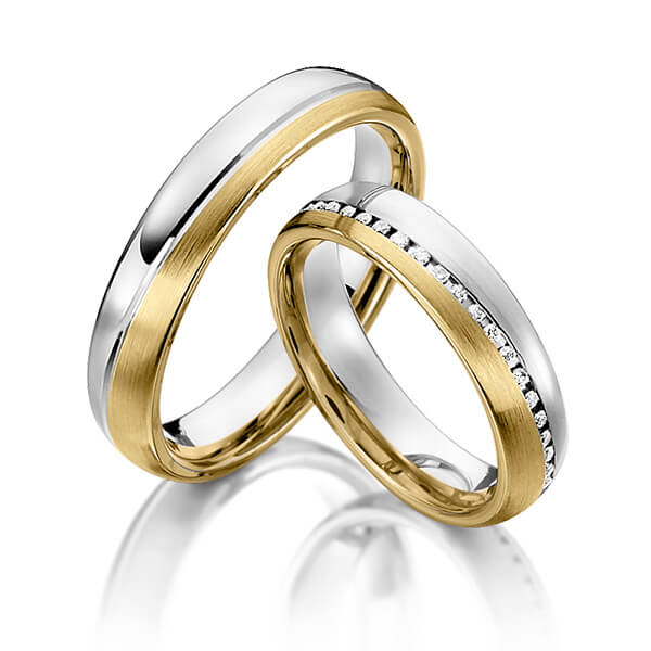 Set Bicolor Memoire-trouwringen in witgoud 14 kt. geelgoud 14 kt. volledig gezet met in totaal 0,295 ct. Briljant tw/si van Steinberg