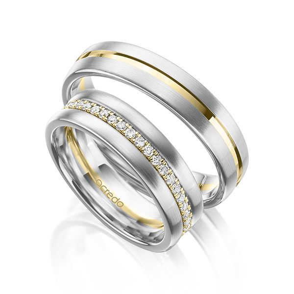 Set Bicolor Memoire-trouwringen in witgoud 14 kt. geelgoud 14 kt. volledig gezet met in totaal 0,38 ct. tw/si van acredo