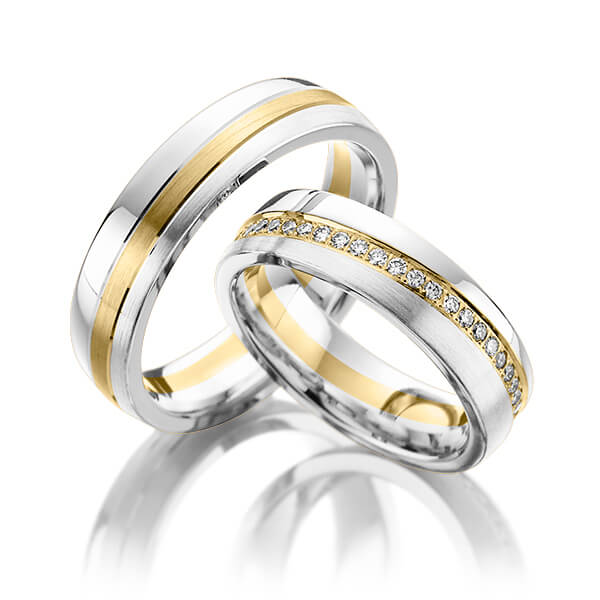 Set Bicolor Memoire-trouwringen in witgoud 14 kt. geelgoud 14 kt. volledig gezet met in totaal 0,45 ct. Briljant tw/si van Steinberg