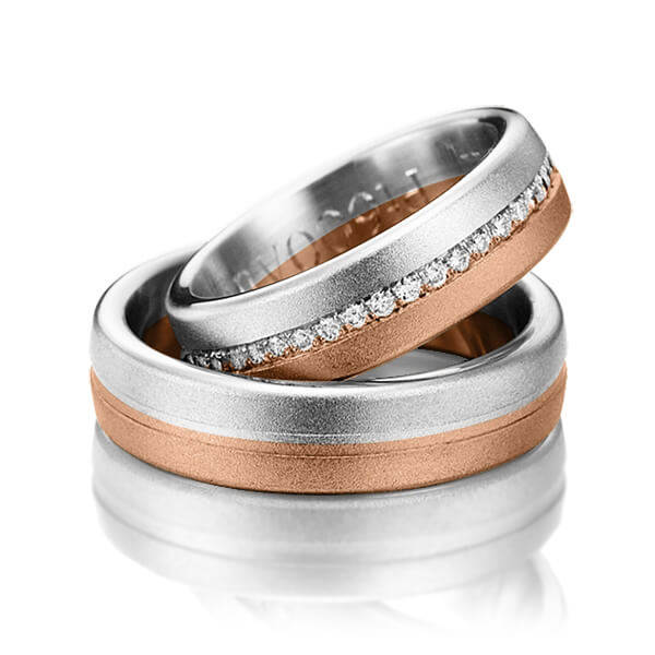 Set Bicolor Memoire-trouwringen in witgoud 14 kt. roodgoud 14 kt. half gezet met in totaal 0,22 ct. Briljant tw/si van Steinberg