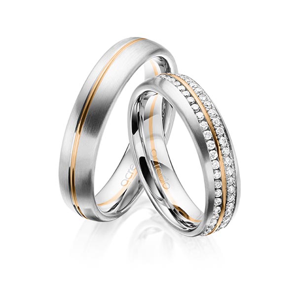 Set Bicolor Memoire-trouwringen in witgoud 14 kt. roségoud 14 kt. volledig gezet met in totaal 0,784 ct. Briljant tw/si van acredo