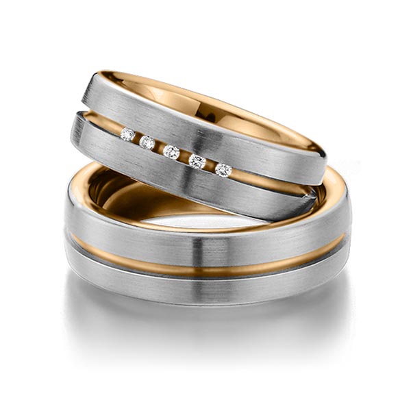 Set Bicolor trouwringen in buiten dark grey gold 14 kt. , binnen roségoud 14 kt. met in totaal 0,075 ct. Briljant tw/si van Eternal Touch