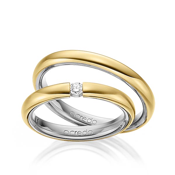Set Bicolor trouwringen in buiten geelgoud 14 kt. , binnen grijsgoud 14 kt. met in totaal 0,08 ct. Briljant tw/si van acredo