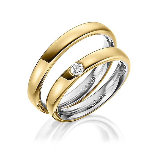 Set Bicolor trouwringen in buiten geelgoud 14 kt. , binnen grijsgoud 14 kt. met in totaal 0,12 ct. Briljant tw/si van acredo