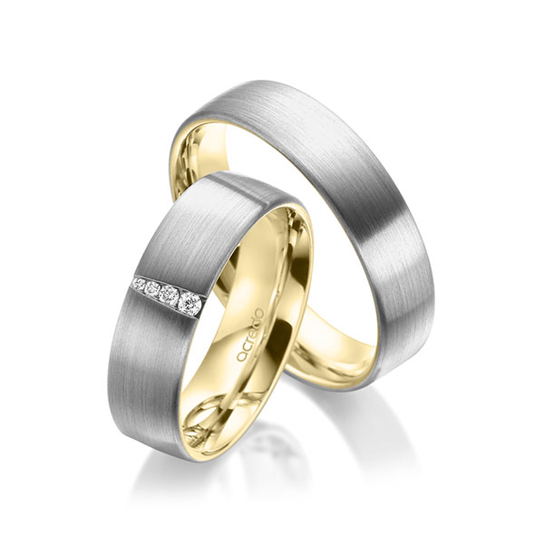 Set Bicolor trouwringen in buiten grijsgoud 14 kt. , binnen geelgoud 14 kt. met in totaal 0,048 ct. Briljant tw/si van acredo
