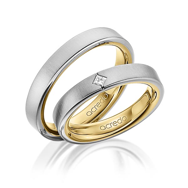 Set Bicolor trouwringen in buiten grijsgoud 14 kt. , binnen geelgoud 14 kt. met in totaal 0,05 ct. Princess-Diamant tw/si van acredo