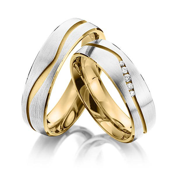 Set Bicolor trouwringen in buiten grijsgoud 14 kt. , binnen geelgoud 14 kt. met in totaal 0,07 ct. Briljant tw/si van Eternal Touch