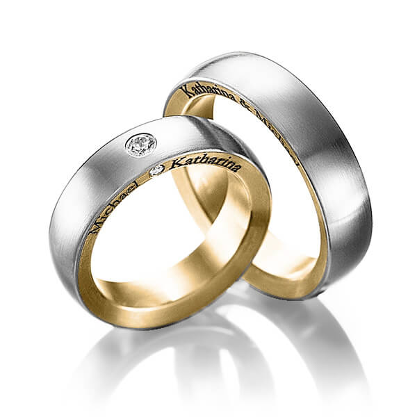 Set Bicolor trouwringen in buiten grijsgoud 14 kt. , binnen geelgoud 14 kt. met in totaal 0,11 ct. Briljant tw/si van Steinberg