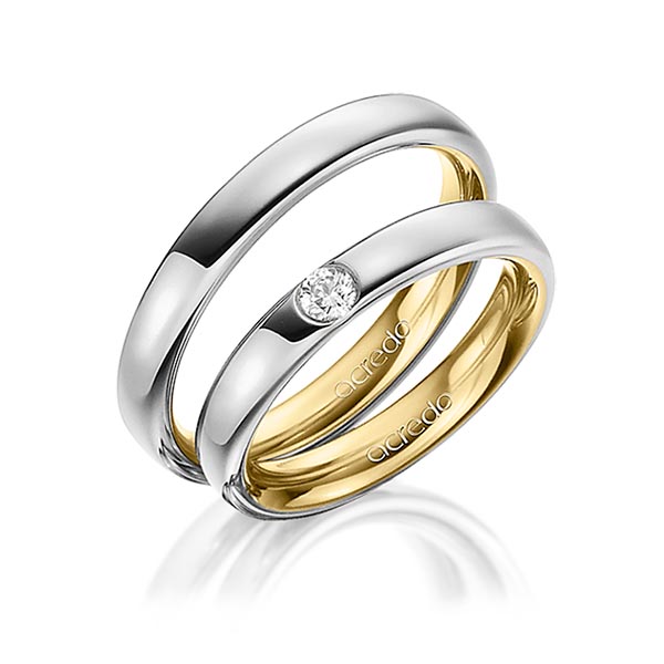 Set Bicolor trouwringen in buiten grijsgoud 14 kt. , binnen geelgoud 14 kt. met in totaal 0,12 ct. Briljant tw/si van acredo