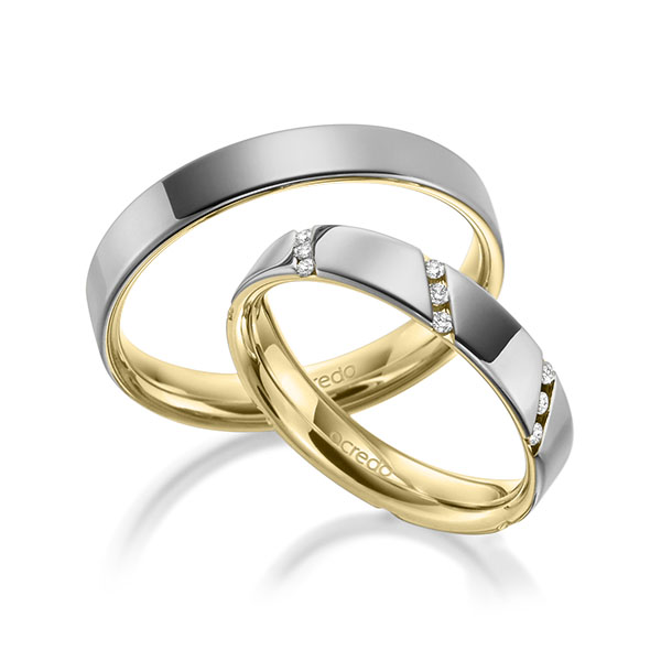 Set Bicolor trouwringen in buiten grijsgoud 14 kt. , binnen geelgoud 14 kt. met in totaal 0,21 ct. Briljant tw/si van acredo