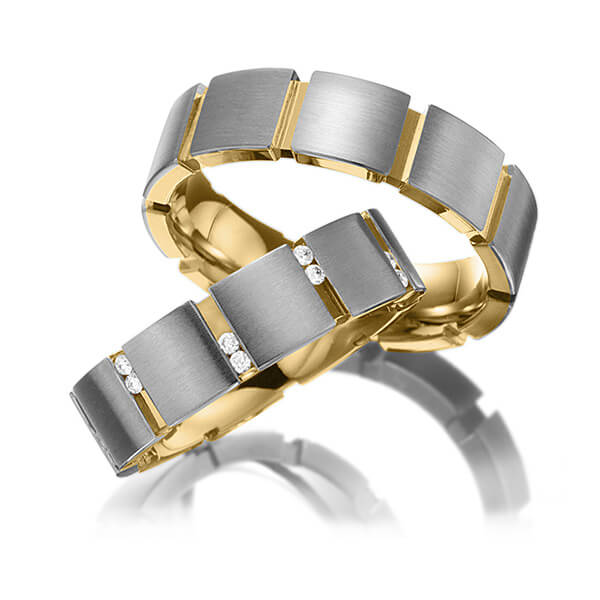 Set Bicolor trouwringen in buiten grijsgoud 14 kt. , binnen geelgoud 14 kt. met in totaal 0,2 ct. Briljant tw/si van Eternal Touch