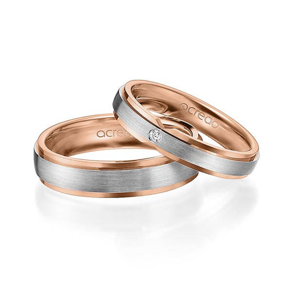 Set Bicolor trouwringen in buiten grijsgoud 14 kt. , binnen roodgoud 14 kt. met in totaal 0,015 ct. Briljant tw/si van acredo