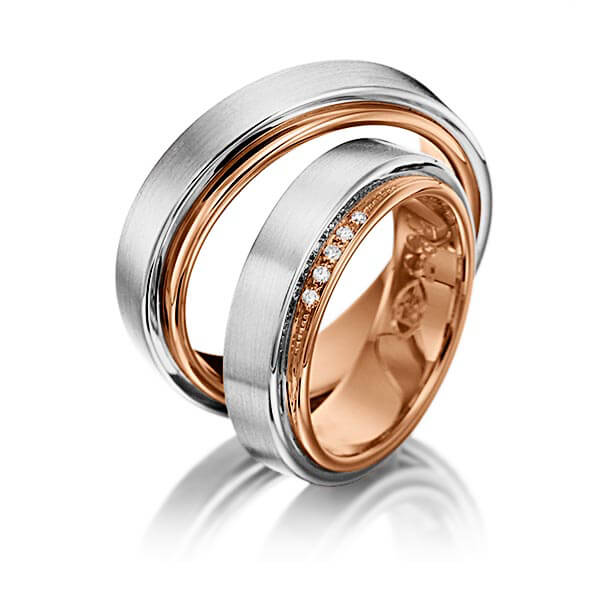 Set Bicolor trouwringen in buiten grijsgoud 14 kt. , binnen roodgoud 14 kt. met in totaal 0,04 ct. Briljant tw/si van Eternal Touch