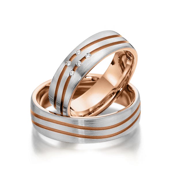 Set Bicolor trouwringen in buiten grijsgoud 14 kt. , binnen roodgoud 14 kt. met in totaal 0,05 ct. Briljant tw/si van Steinberg