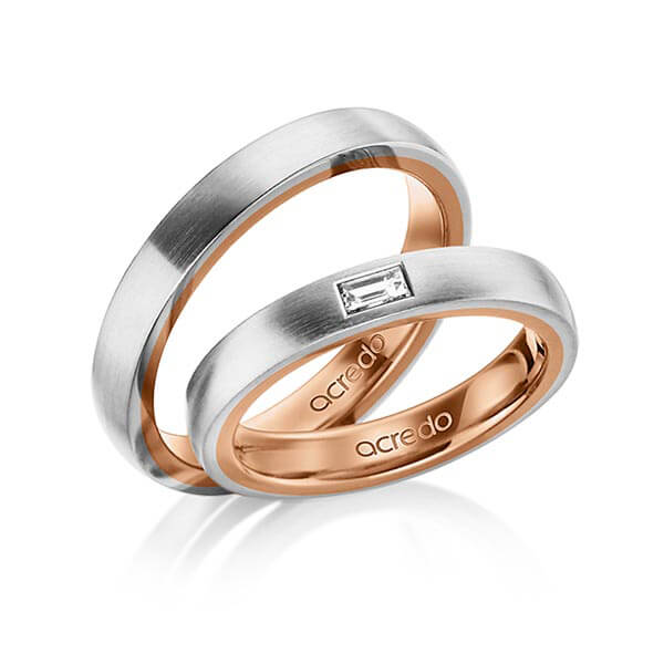 Set Bicolor trouwringen in buiten grijsgoud 14 kt. , binnen roodgoud 14 kt. met in totaal 0,15 ct. Baguette-Diamant tw,vs van acredo