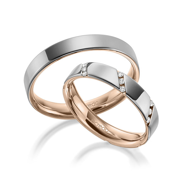 Set Bicolor trouwringen in buiten grijsgoud 14 kt. , binnen roodgoud 14 kt. met in totaal 0,21 ct. Briljant tw/si van acredo