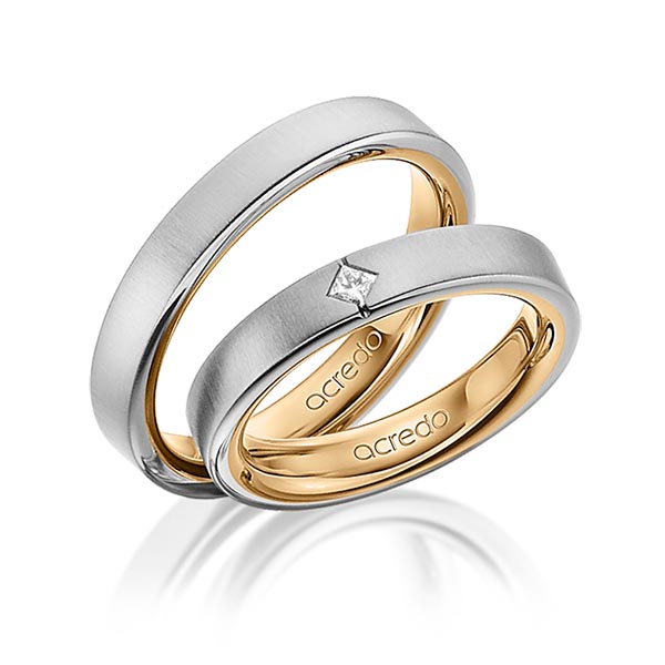 Set Bicolor trouwringen in buiten grijsgoud 14 kt. , binnen roségoud 14 kt. met in totaal 0,05 ct. Princess-Diamant tw/si van acredo