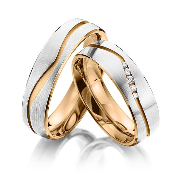 Set Bicolor trouwringen in buiten grijsgoud 14 kt. , binnen roségoud 14 kt. met in totaal 0,07 ct. Briljant tw/si van Eternal Touch