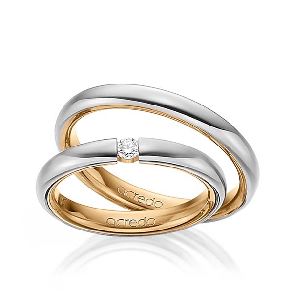 Set Bicolor trouwringen in buiten grijsgoud 14 kt. , binnen roségoud 14 kt. met in totaal 0,08 ct. Briljant tw/si van acredo