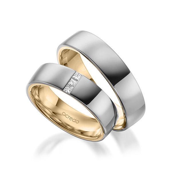 Set Bicolor trouwringen in buiten grijsgoud 14 kt. , binnen roségoud 14 kt. met in totaal 0,09 ct. Princess-Diamant tw/si van acredo