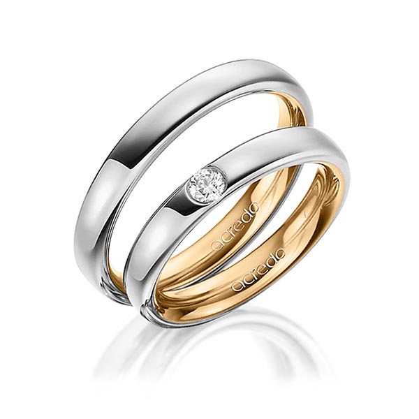 Set Bicolor trouwringen in buiten grijsgoud 14 kt. , binnen roségoud 14 kt. met in totaal 0,12 ct. Briljant tw/si van acredo