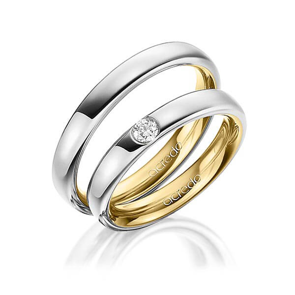 Set Bicolor trouwringen in buiten platina 950 , binnen geelgoud 18 kt. met in totaal 0,12 ct. Briljant tw/si van acredo