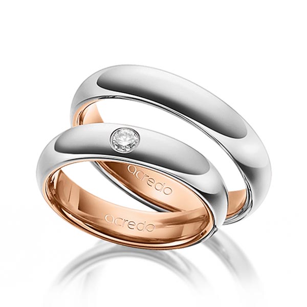 Set Bicolor trouwringen in buiten platina 950 , binnen roodgoud 18 kt. met in totaal 0,1 ct. Briljant tw/si van acredo