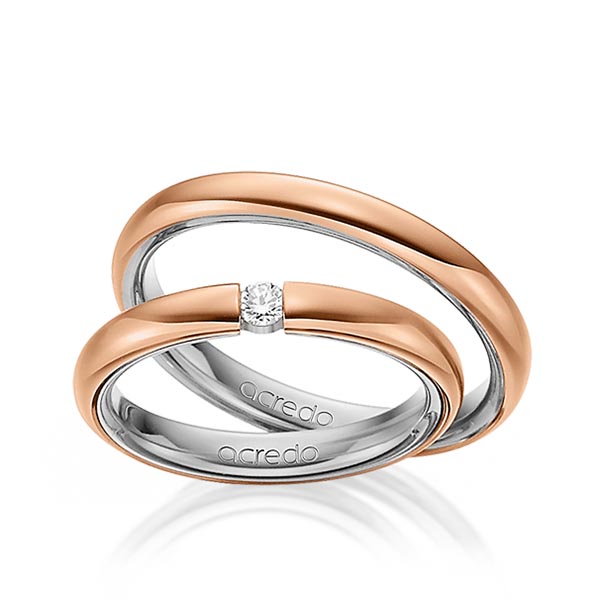 Set Bicolor trouwringen in buiten roodgoud 14 kt. , binnen grijsgoud 14 kt. met in totaal 0,08 ct. Briljant tw/si van acredo