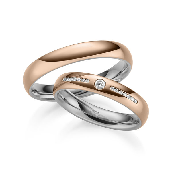 Set Bicolor trouwringen in buiten roodgoud 14 kt. , binnen grijsgoud 14 kt. met in totaal 0,12 ct. Briljant tw/si 