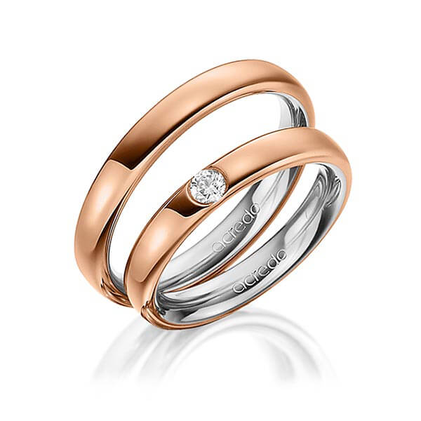 Set Bicolor trouwringen in buiten roodgoud 14 kt. , binnen grijsgoud 14 kt. met in totaal 0,12 ct. Briljant tw/si van acredo
