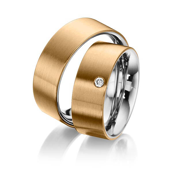 Set Bicolor trouwringen in buiten roségoud 14 kt. , binnen edelstaal met in totaal 0,05 ct. Briljant tw/si van Eternal Touch