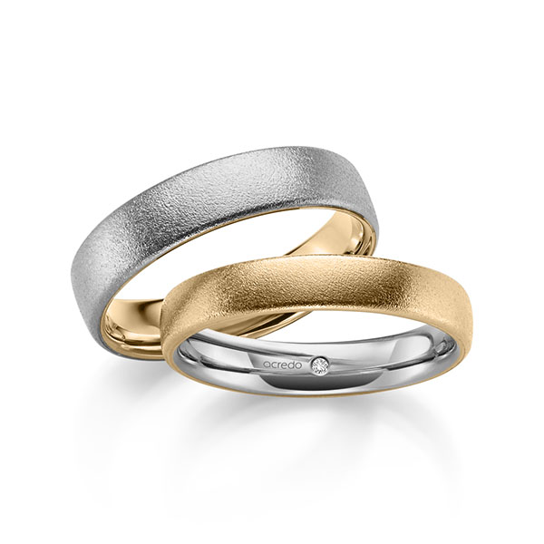 Set Bicolor trouwringen in buiten roségoud 14 kt. , binnen grijsgoud 14 kt. met in totaal 0,02 ct. Briljant tw/si van acredo