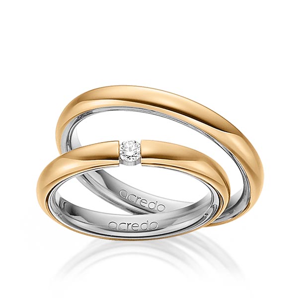 Set Bicolor trouwringen in buiten roségoud 14 kt. , binnen grijsgoud 14 kt. met in totaal 0,08 ct. Briljant tw/si van acredo