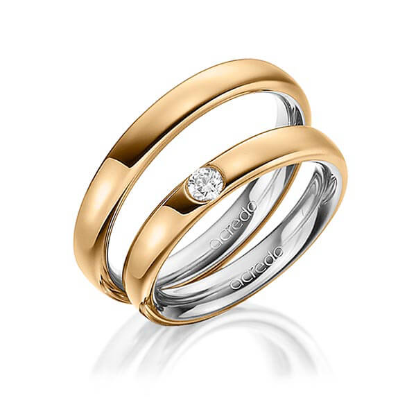 Set Bicolor trouwringen in buiten roségoud 14 kt. , binnen grijsgoud 14 kt. met in totaal 0,12 ct. Briljant tw/si van acredo