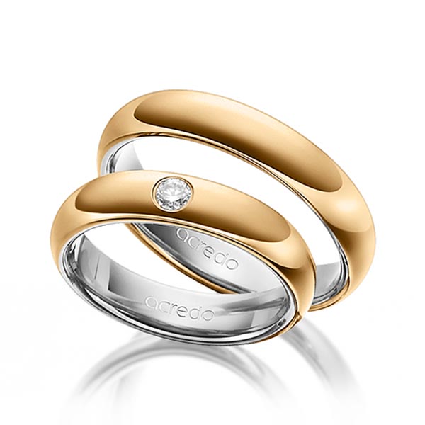 Set Bicolor trouwringen in buiten roségoud 14 kt. , binnen grijsgoud 14 kt. met in totaal 0,1 ct. Briljant tw/si van acredo