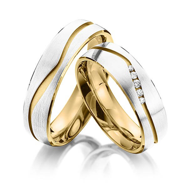 Set Bicolor trouwringen in buiten witgoud 14 kt. , binnen geelgoud 14 kt. met in totaal 0,07 ct. Briljant tw/si van Eternal Touch